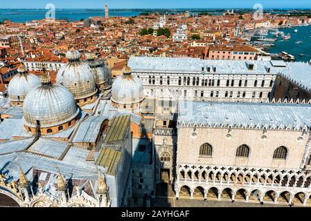 Aerial view of Venice, Italy. Domes of St Mark`s Basilica and Doge`s Palace in the foreground. Stock Photo